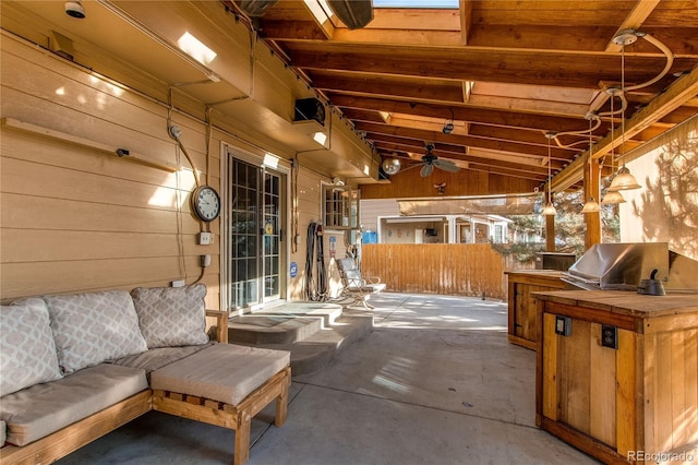 view of patio / terrace featuring exterior kitchen, a grill, fence, and ceiling fan