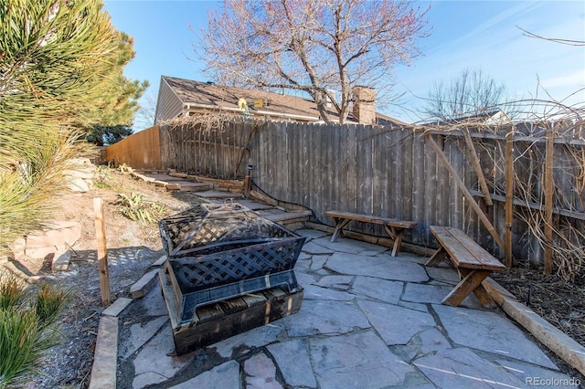 view of patio / terrace featuring fence