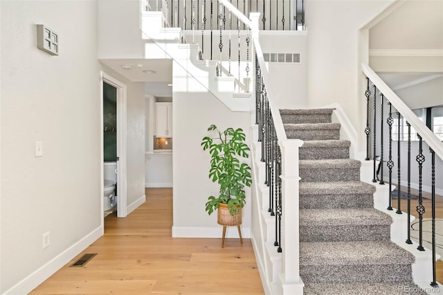 stairway with wood-type flooring