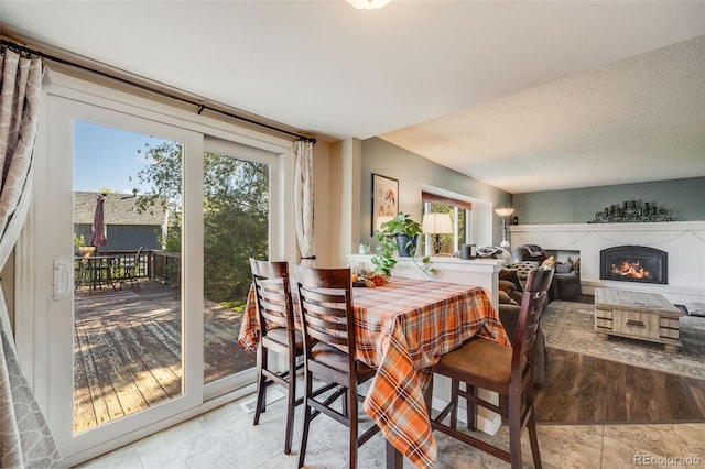 9926 W Nova Pl, Littleton, CO 80127 - dining area with a fireplace