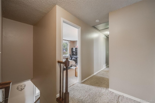 9926 W Nova Pl, Littleton, CO 80127 - hall featuring an upstairs landing, carpet floors, and a textured ceiling