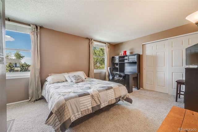 9926 W Nova Pl, Littleton, CO 80127 - carpeted bedroom with a closet and a textured ceiling
