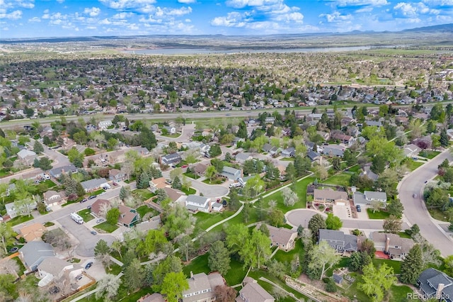 9926 W Nova Pl, Littleton, CO 80127 - aerial view of property's location with nearby suburban area and a mountainous background