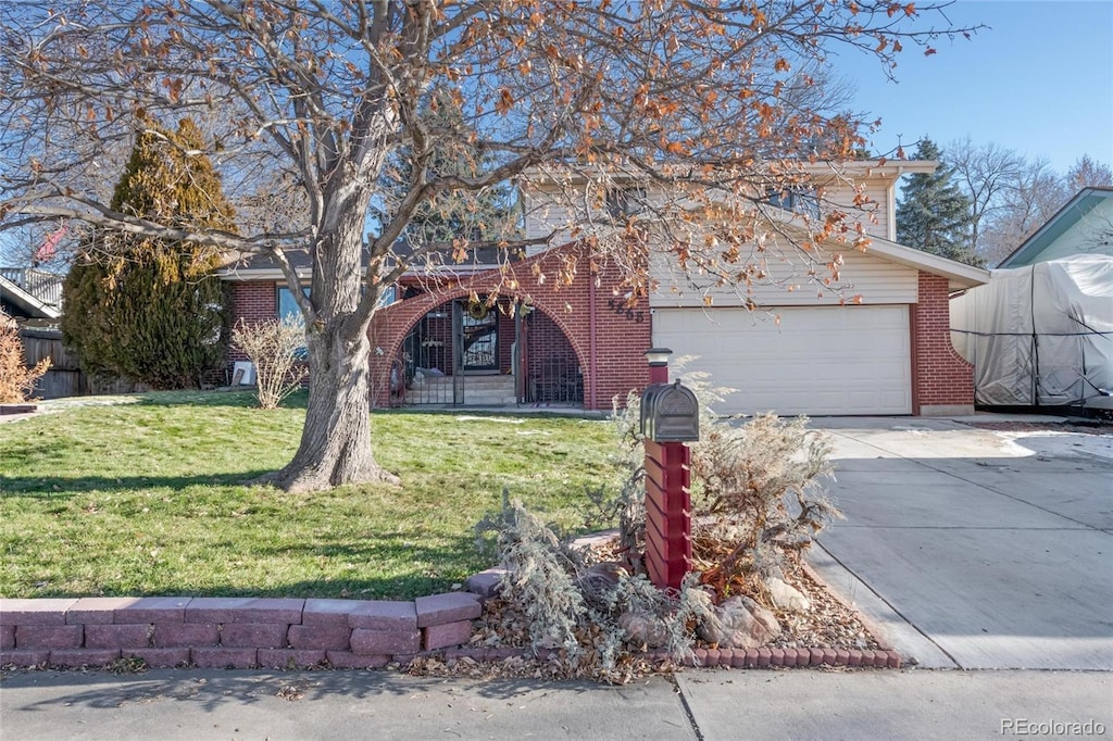 obstructed view of property featuring a front yard and a garage