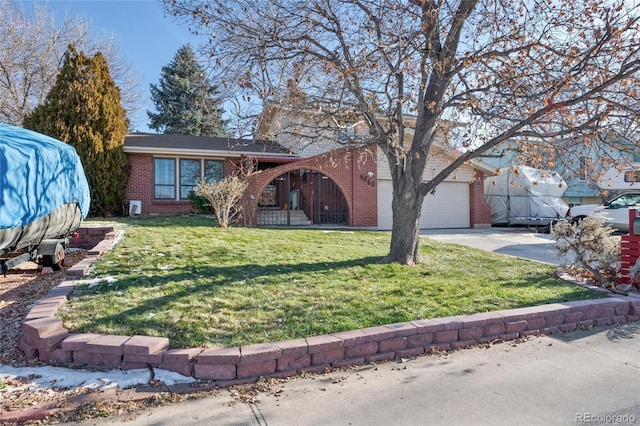 view of front facade featuring a front yard and a garage