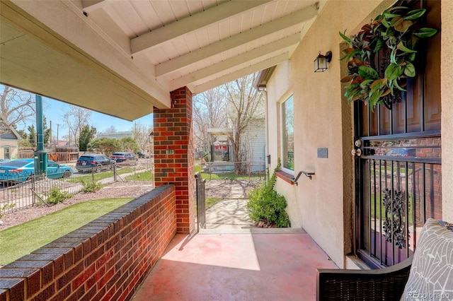 view of patio / terrace featuring fence