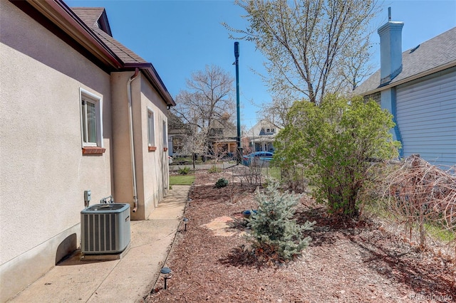 view of yard with central AC