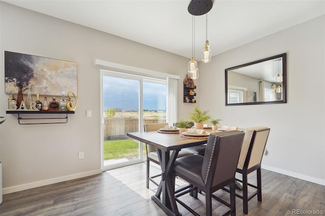 dining space featuring dark hardwood / wood-style flooring