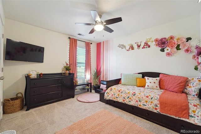 bedroom with ceiling fan and light colored carpet