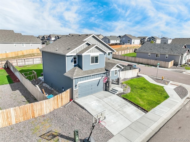 view of front facade featuring a garage and a front lawn