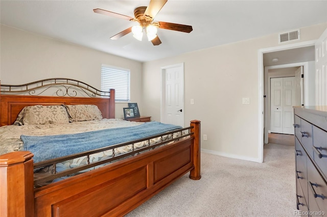 bedroom with ceiling fan and light carpet