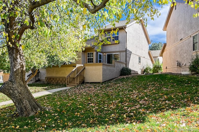 view of front of home with a front yard