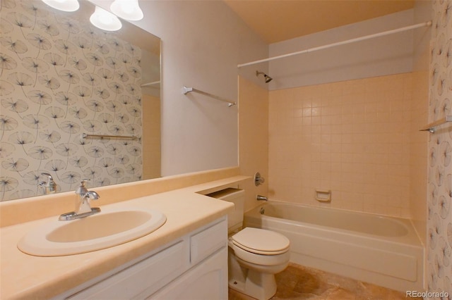 full bathroom with vanity, toilet, and tiled shower / bath