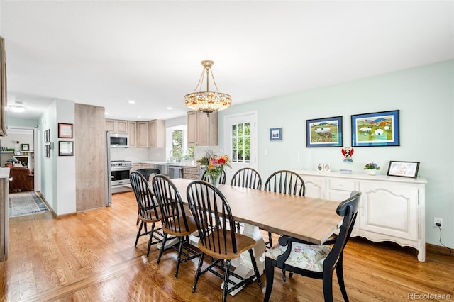 9765 W 77th Dr, Arvada, CO 80005 - dining space with light wood-style flooring, baseboards, and recessed lighting