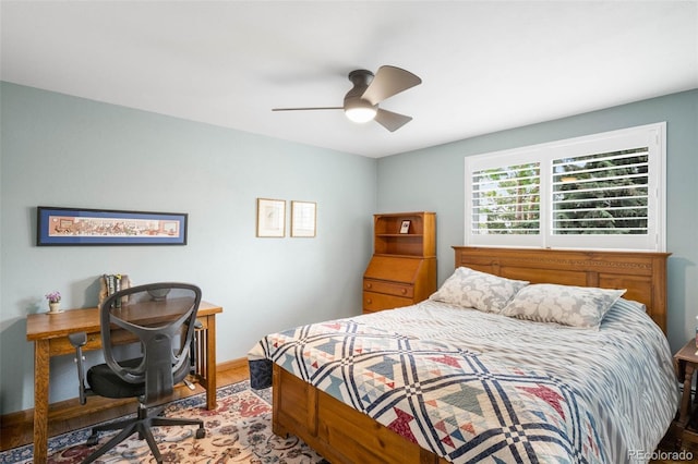 9765 W 77th Dr, Arvada, CO 80005 - bedroom featuring wood finished floors, ceiling fan, and baseboards