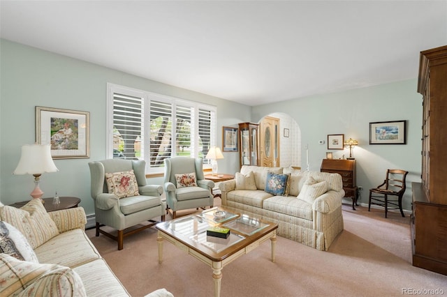9765 W 77th Dr, Arvada, CO 80005 - living area with arched walkways, light carpet, and a baseboard radiator