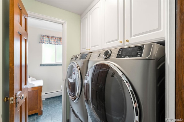 9765 W 77th Dr, Arvada, CO 80005 - laundry room with a baseboard heating unit, washer and dryer, cabinet space, and tile patterned flooring