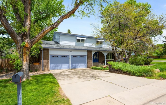 9765 W 77th Dr, Arvada, CO 80005 - traditional-style home featuring concrete driveway, brick siding, and covered porch