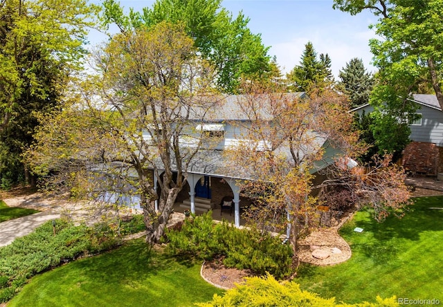 9765 W 77th Dr, Arvada, CO 80005 - back of house featuring a yard