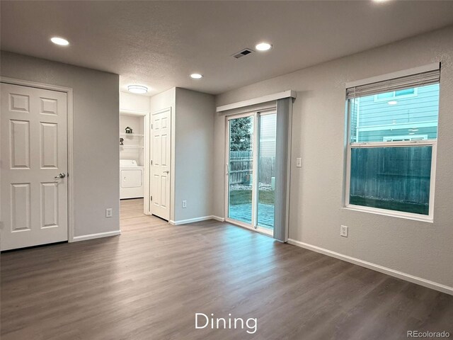 10676 Forester Pl, Longmont, CO 80504 - empty room featuring wood finished floors, washer / clothes dryer, baseboards, and recessed lighting