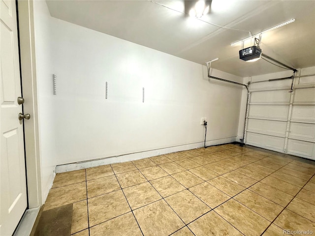 10676 Forester Pl, Longmont, CO 80504 - garage with a garage door opener and baseboards