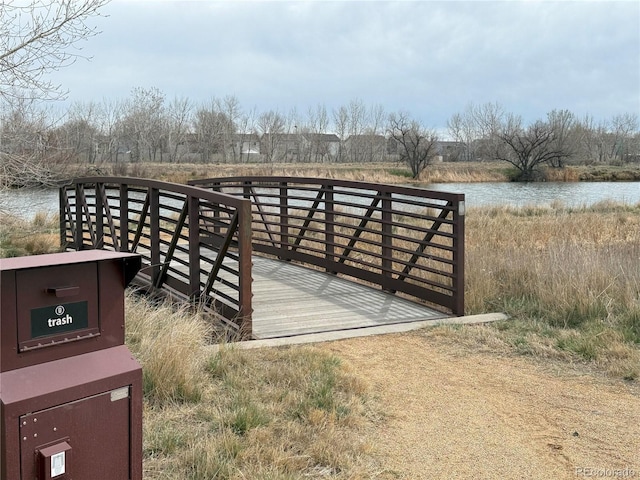 10676 Forester Pl, Longmont, CO 80504 - wooden deck featuring a water view