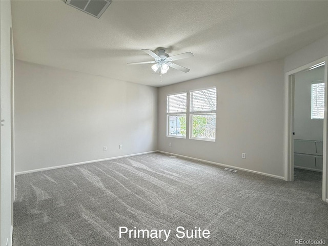10676 Forester Pl, Longmont, CO 80504 - unfurnished room with a ceiling fan, carpet flooring, baseboards, and a textured ceiling