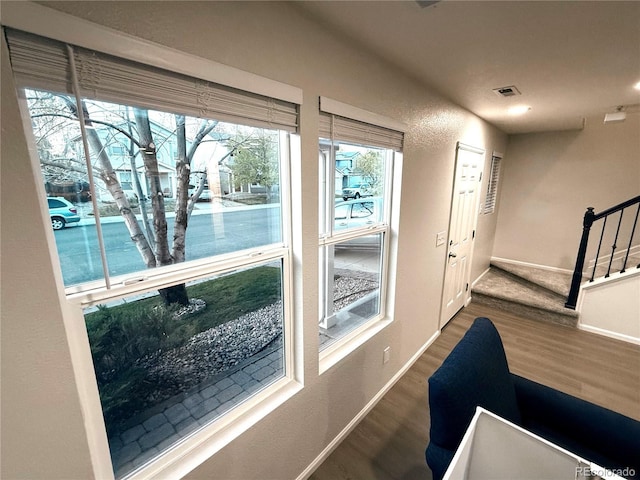 10676 Forester Pl, Longmont, CO 80504 - doorway to outside with wood finished floors and baseboards