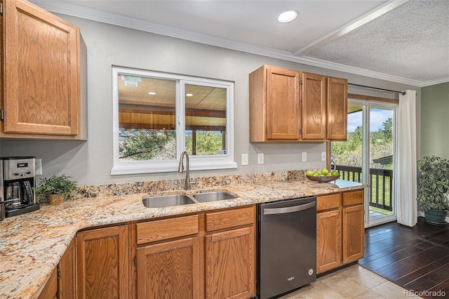 19260 Spring Valley Rd, Monument, CO 80132 - kitchen with stainless steel dishwasher, a sink, light stone countertops, crown molding, and recessed lighting