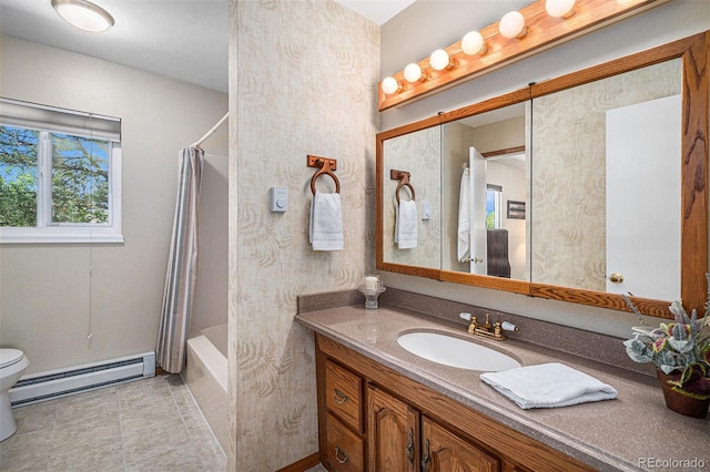 19260 Spring Valley Rd, Monument, CO 80132 - full bath with a baseboard radiator, vanity, toilet, shower / bath combination with curtain, and baseboards