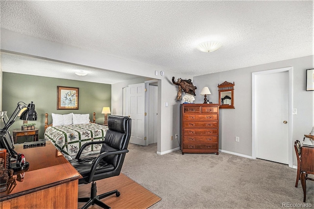 19260 Spring Valley Rd, Monument, CO 80132 - carpeted bedroom featuring an office area, a textured ceiling, and baseboards