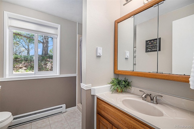 19260 Spring Valley Rd, Monument, CO 80132 - full bath with baseboard heating, toilet, vanity, tile patterned floors, and a shower