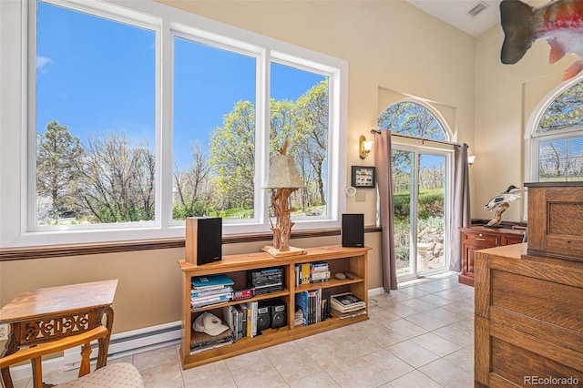 19260 Spring Valley Rd, Monument, CO 80132 - living area featuring healthy amount of natural light, light tile patterned floors, and baseboards