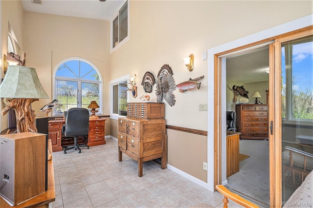 19260 Spring Valley Rd, Monument, CO 80132 - office area with healthy amount of natural light, light tile patterned floors, baseboards, and a high ceiling