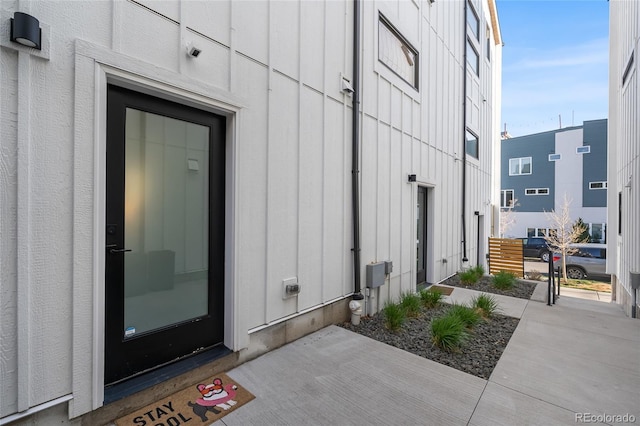 1305 Osceola St, Denver, CO 80204 - view of exterior entry featuring board and batten siding