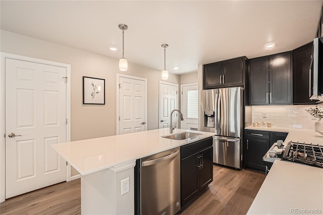 12770 Tamarac St, Thornton, CO 80602 - kitchen with light countertops, appliances with stainless steel finishes, a sink, and light wood-style flooring