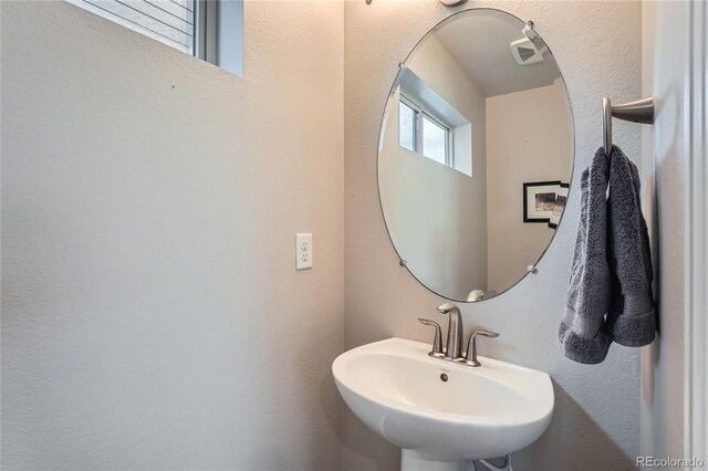 12770 Tamarac St, Thornton, CO 80602 - bathroom with a sink and a textured wall