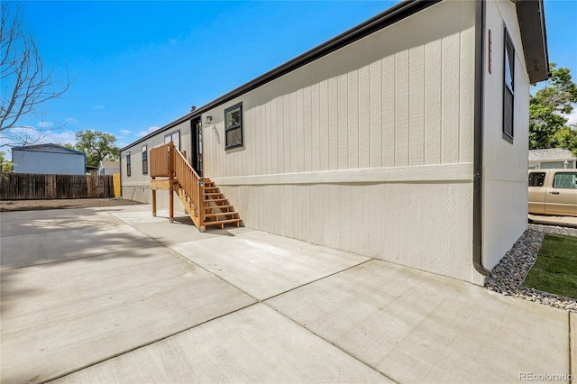8497 Madison Way, Denver, CO 80229 - view of home's exterior with a patio area