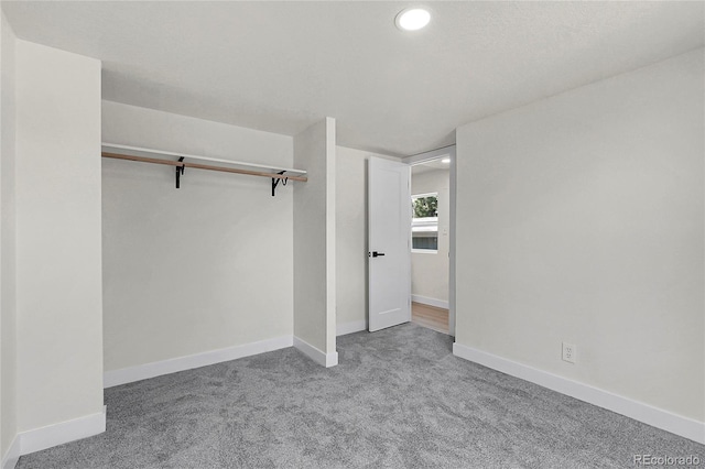 8497 Madison Way, Denver, CO 80229 - unfurnished bedroom with carpet, recessed lighting, baseboards, and a closet