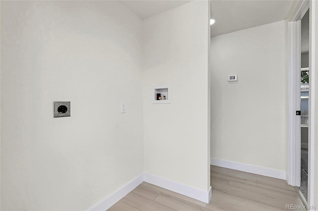 8497 Madison Way, Denver, CO 80229 - laundry area featuring washer hookup, hookup for an electric dryer, light wood finished floors, and baseboards