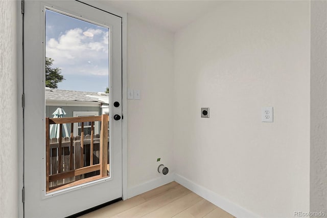 8497 Madison Way, Denver, CO 80229 - doorway to outside with light wood finished floors and baseboards
