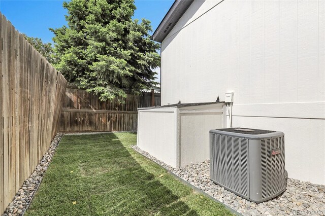 8497 Madison Way, Denver, CO 80229 - view of yard featuring central air condition unit