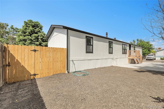 8497 Madison Way, Denver, CO 80229 - view of side of property with a gate