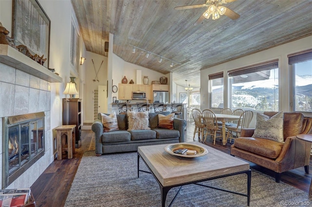 965 Four Oclock Rd, Breckenridge, CO 80424 - living area featuring wood finished floors, wood ceiling, a ceiling fan, plenty of natural light, and a tile fireplace