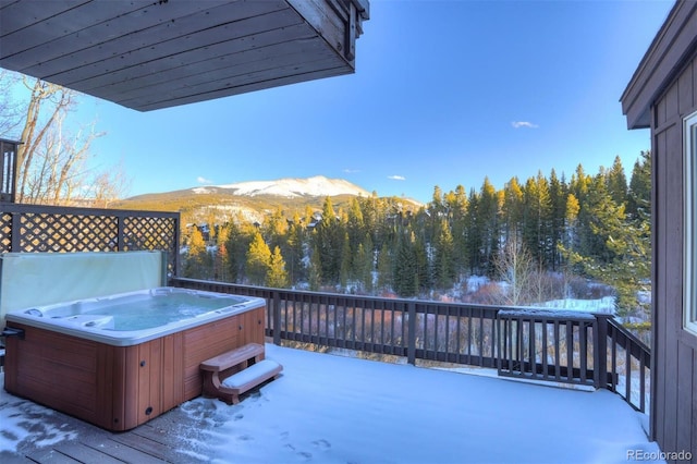 965 Four Oclock Rd, Breckenridge, CO 80424 - deck featuring a hot tub, a mountain view, and a view of trees