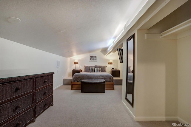965 Four Oclock Rd, Breckenridge, CO 80424 - bedroom featuring light colored carpet, vaulted ceiling, and a textured ceiling