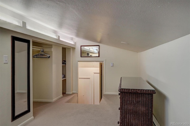 965 Four Oclock Rd, Breckenridge, CO 80424 - hall with a textured ceiling, carpet, and vaulted ceiling