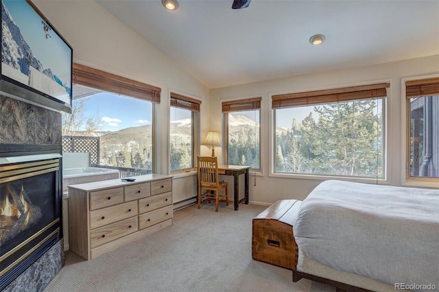 965 Four Oclock Rd, Breckenridge, CO 80424 - bedroom with lofted ceiling, multiple windows, light carpet, a fireplace, and recessed lighting