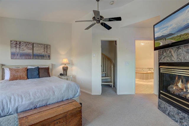 965 Four Oclock Rd, Breckenridge, CO 80424 - carpeted bedroom featuring a glass covered fireplace, ensuite bathroom, and a ceiling fan