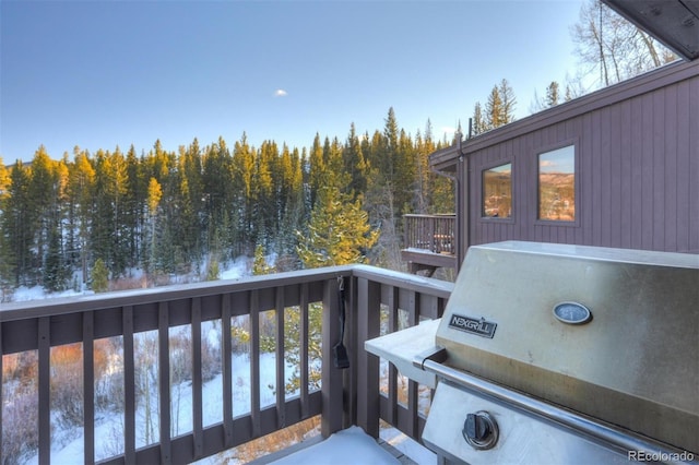 965 Four Oclock Rd, Breckenridge, CO 80424 - snow covered back of property featuring a grill and a view of trees